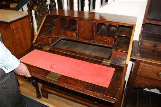 An early 18th century walnut and featherbanded bureau, W.3ft